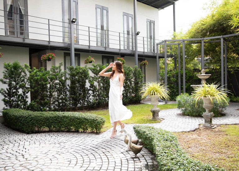 Spa Garden Greenery, Neutral Color Spa Building, Woman In White Dress